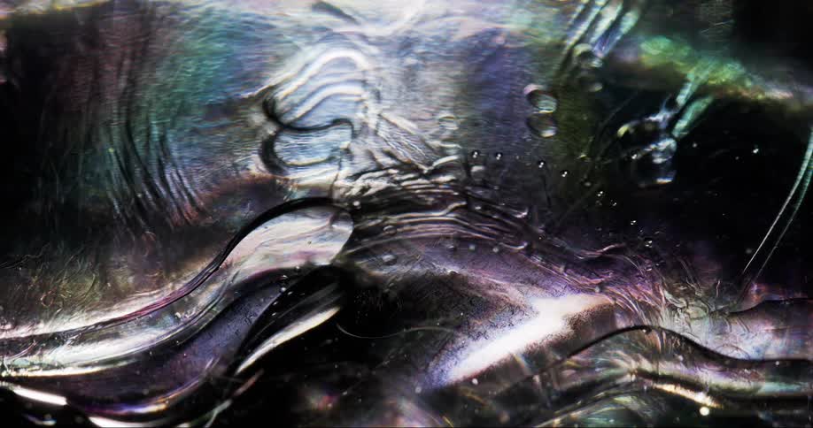 A colorful shiny abstract of swirling liquid and bubbles
