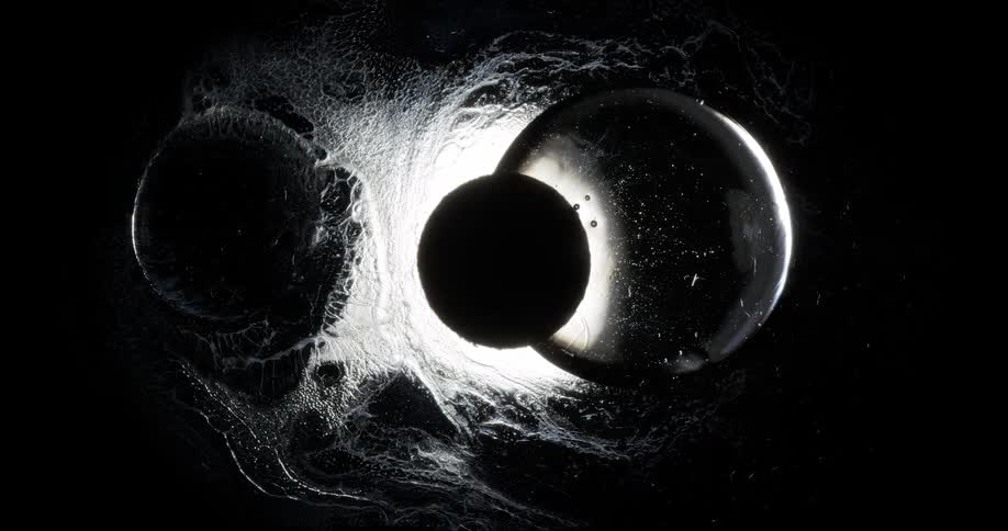 A dark and light abstract clip of ovals