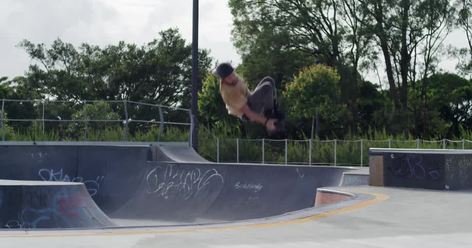 A man does a large jump on the ramp