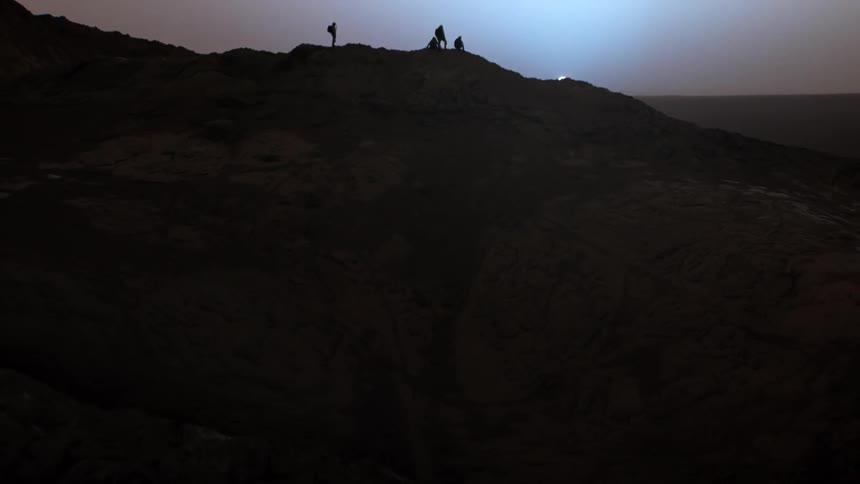 Four people watching a sunset on Mars