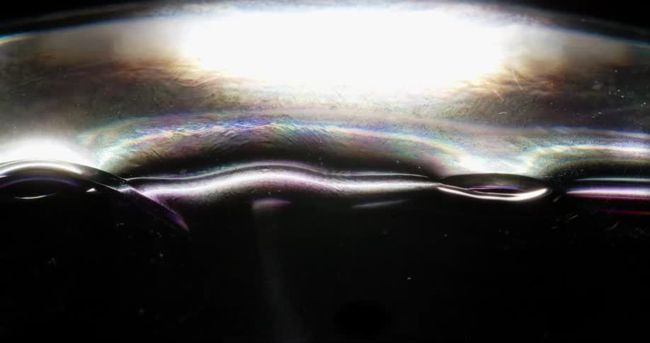 Fluid art with colorful wavy reflections