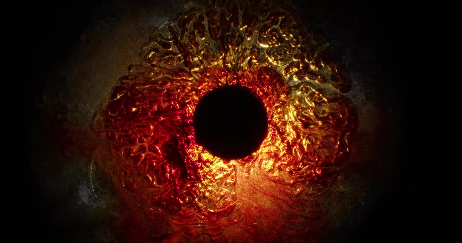 A black hole is surrounded by a rippling glowing red and orange substance in the darkness