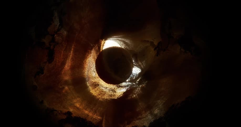 Abstract wait and amidst a dense yellowish liquid that attaches it