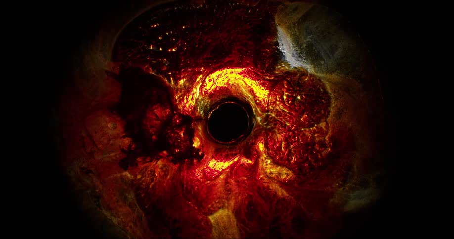 A dark hole surrounded by amagma and lava
