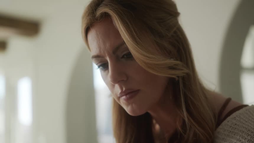 A woman reading something intently
