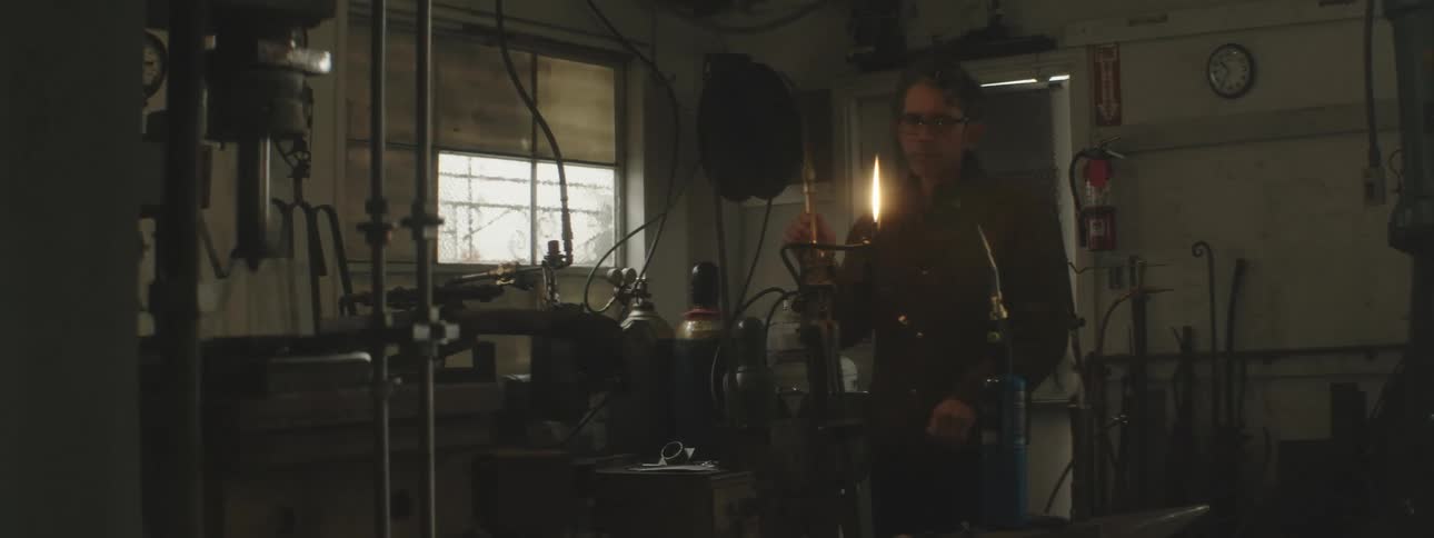 A man is welding in his shop