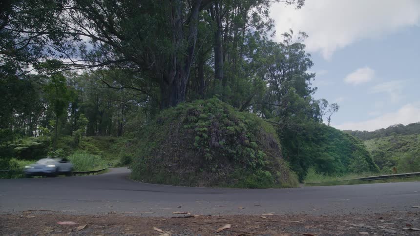 A car drives and turns around the road