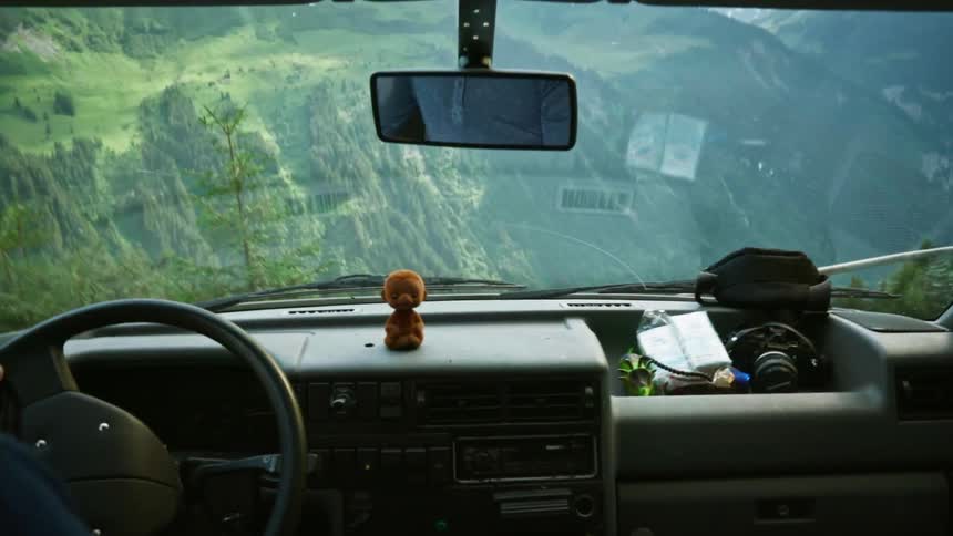 A person tries to control the car on a dangerous road