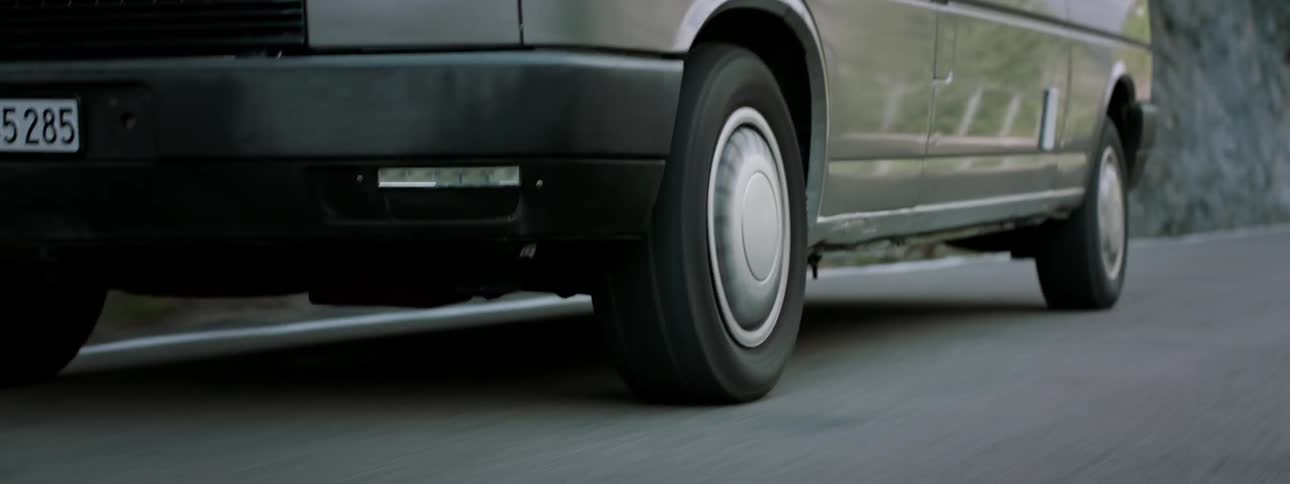 A car is traveling on the road