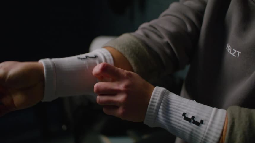 A man puts arm socks on