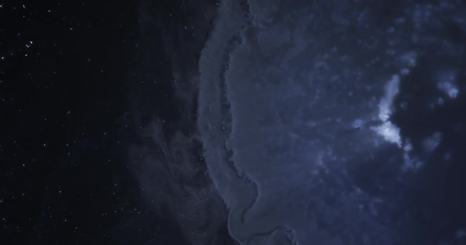 Gray fluid flowing from glowing center expands against white spotted darkness
