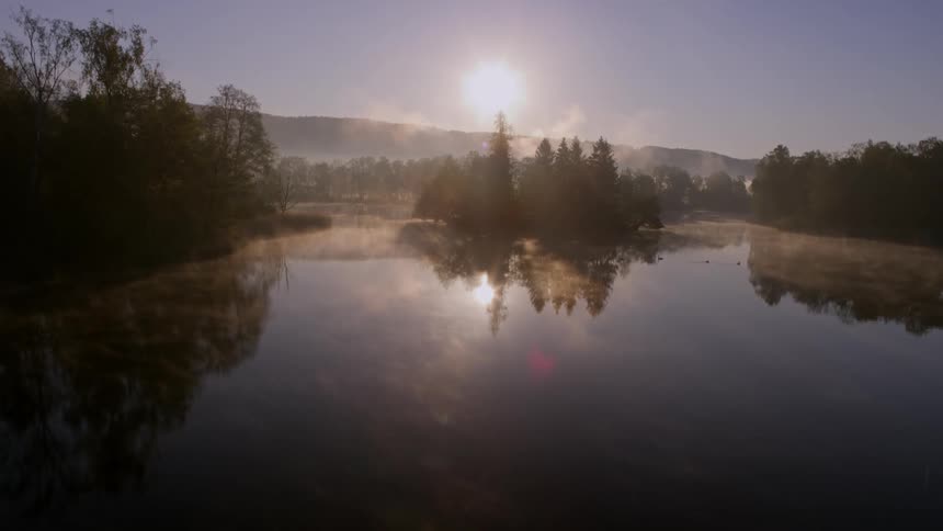 The lake is surrounded by trees