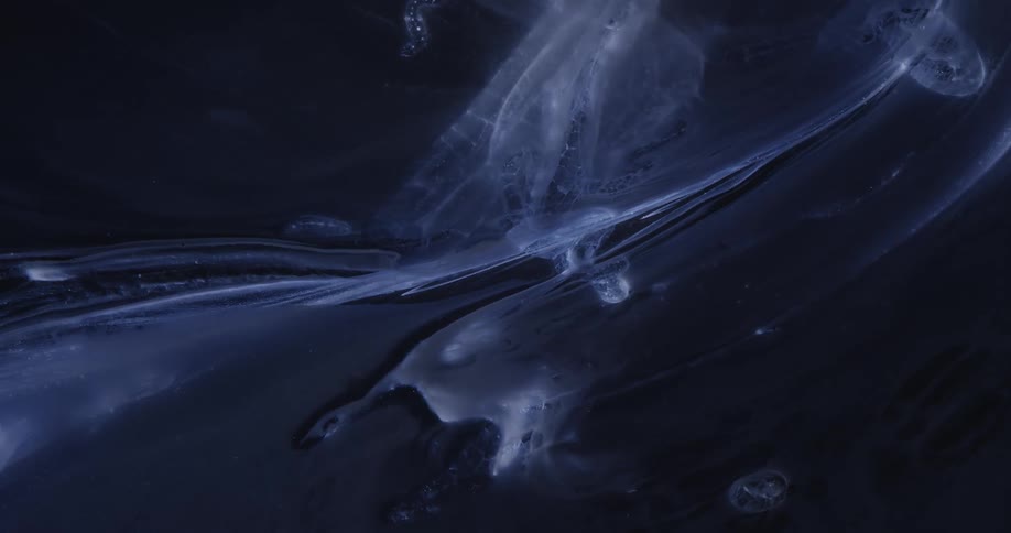 Abstract smoke swirling against a backdrop of a starry sky