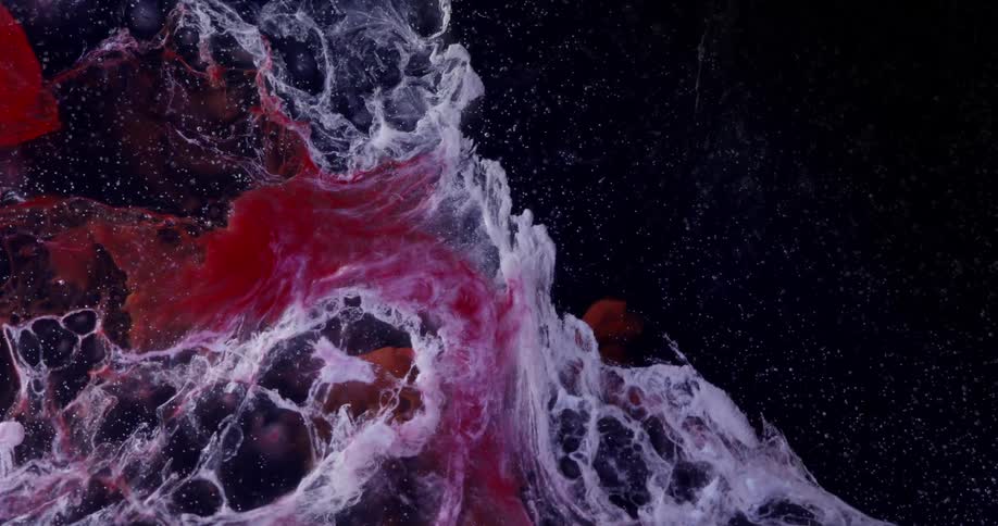 A red and white cloud coming out of a black background
