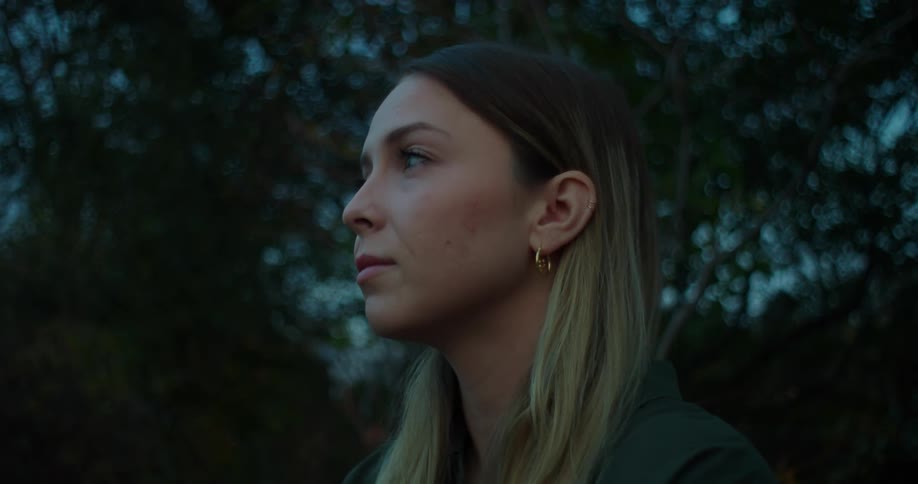 A woman meditating outdoors