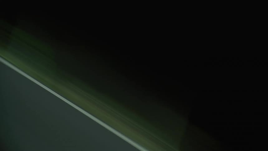 Grassy shoulder of a road at night