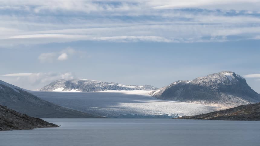 Arctic landscape with ocean and clouds passing by in timelapse
