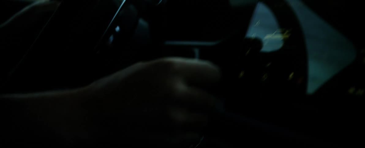 A man drives a vehicle through a desert