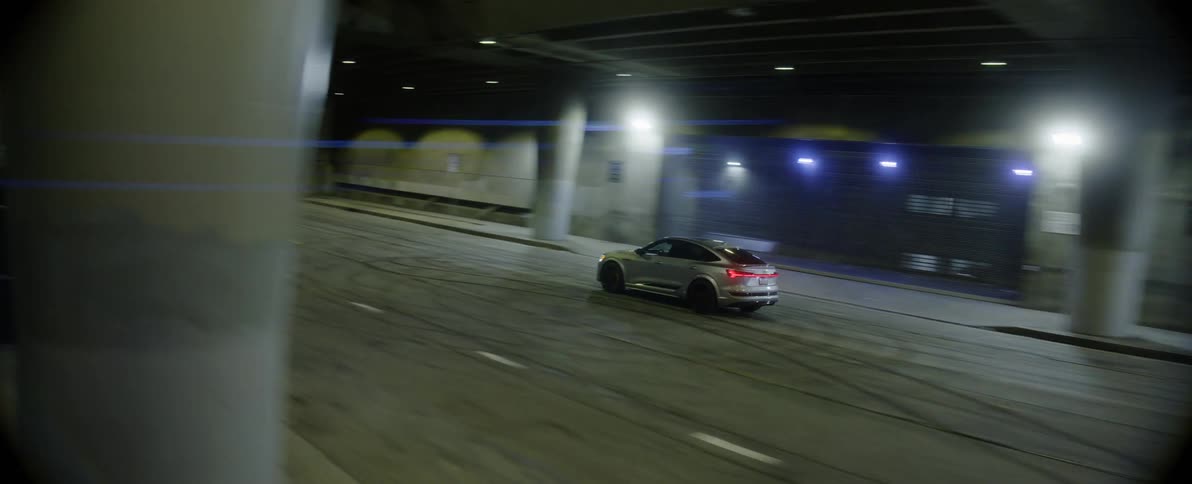 A vehicles drives down the tunnel road