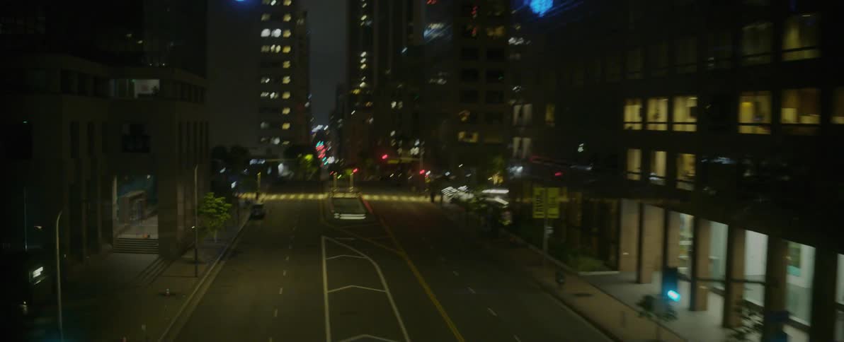 Rows of large buildings near a street in a city