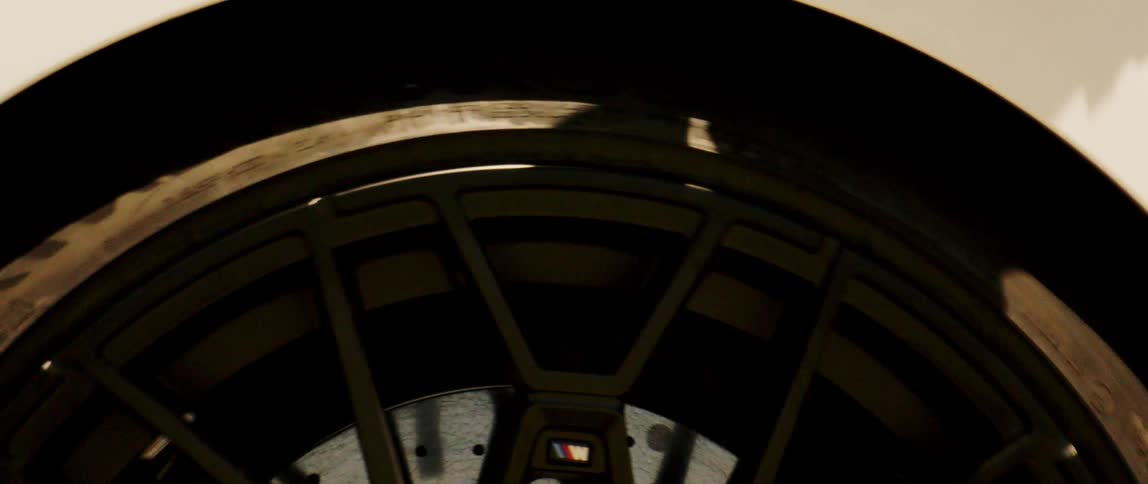 Extreme closeup on a moving bmw alloy wheel