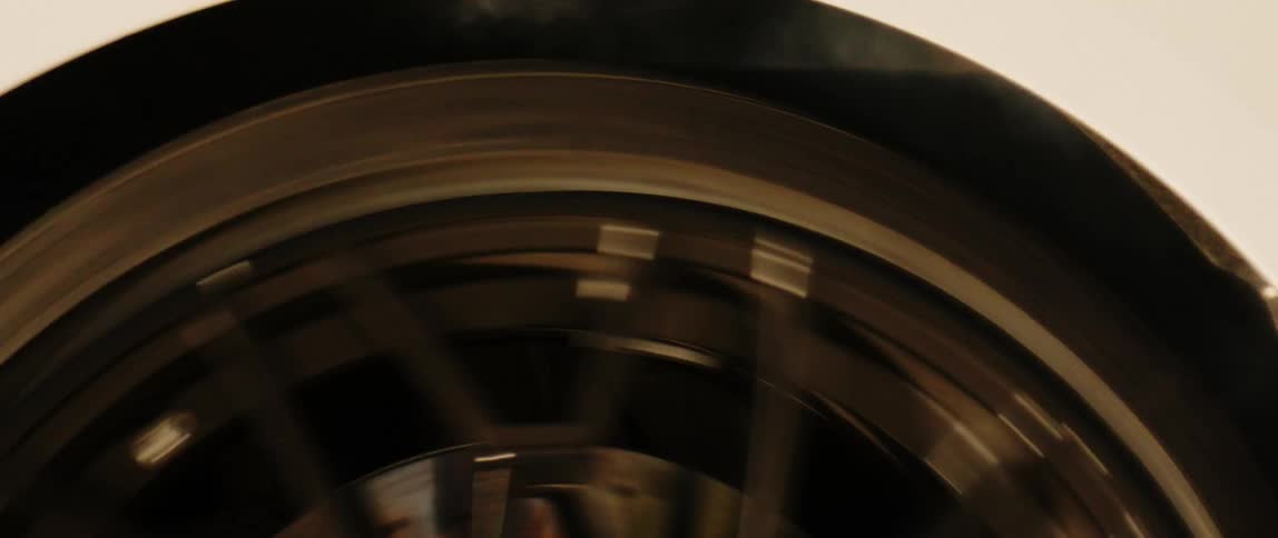Close up of a car tire spinning while creating smoke