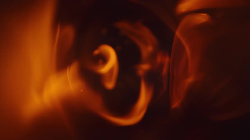 Fire flames in slow motion passing through the metallic tunnel