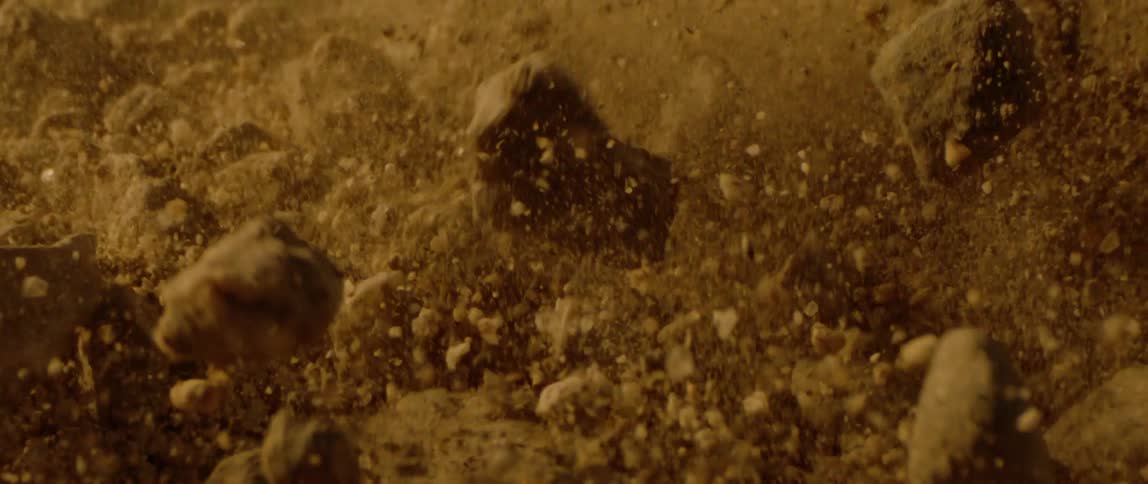 Brown rocks of various shapes and sizes bounce around during an earthquake