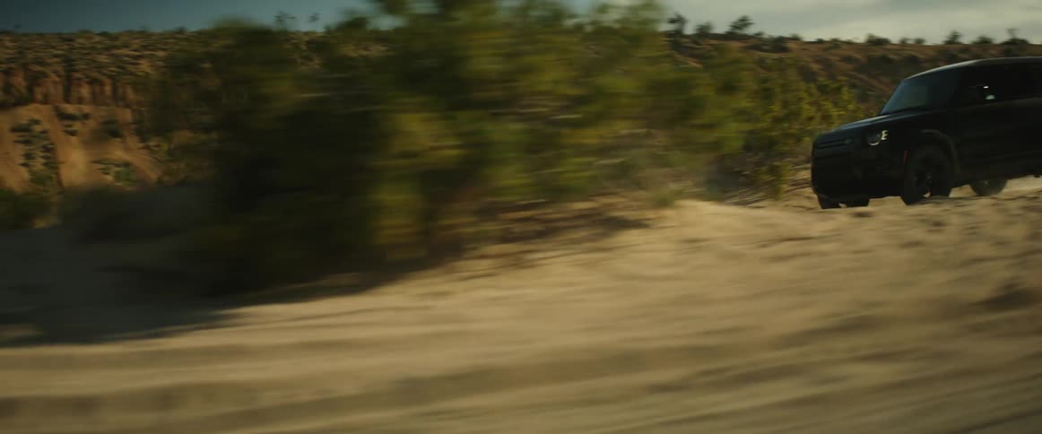 A vehicle goes off road in a desert