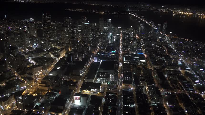 Aerial view of the city and tall buildings at night