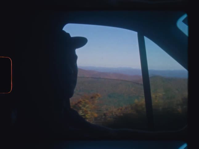 A man drives a vehicle