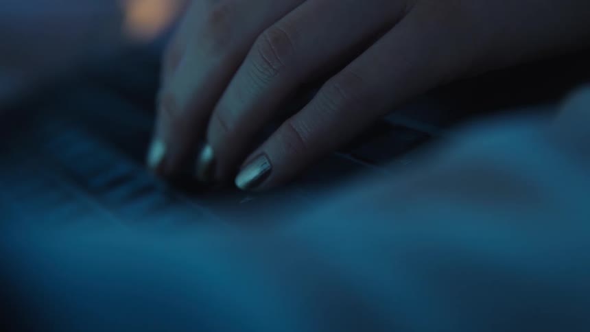 A person is typing on the keyboard