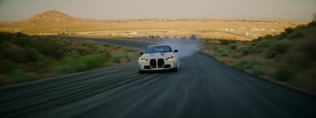 A car drifts around the winding roads