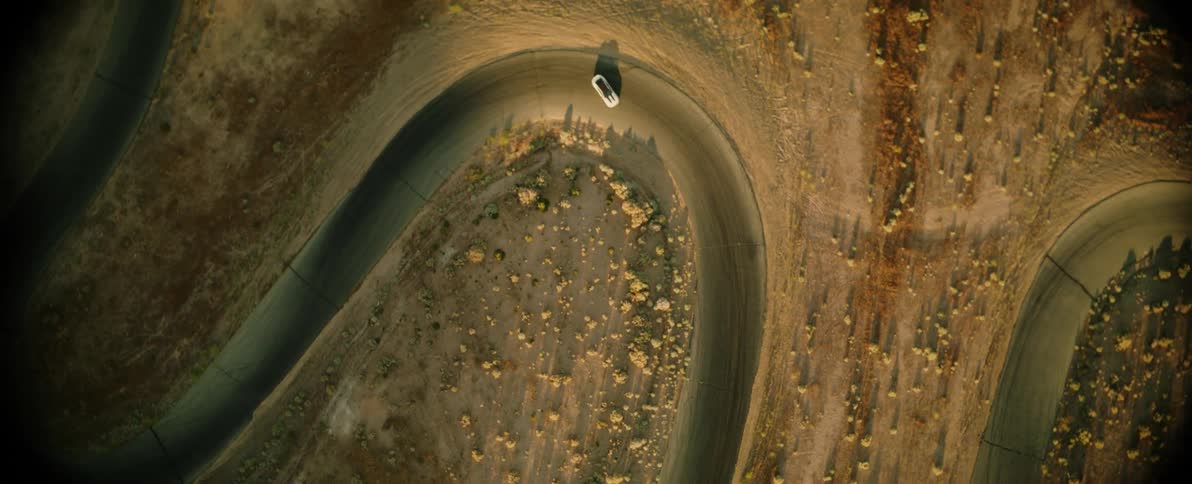 A car drifts around the winding road
