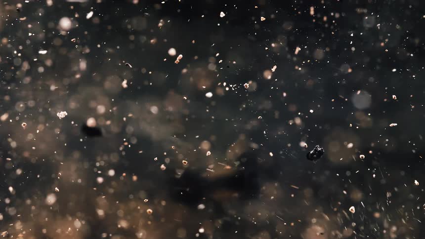 Stone debris flying through the air