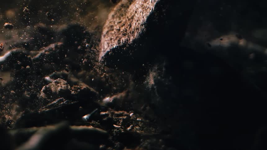 Pieces of rock and dust fall