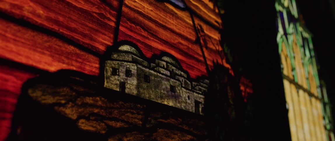 A close up of a painting on stained glass