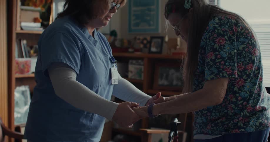 A nurse helping a patient with treatment at home