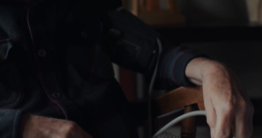 A man is recording his blood pressure