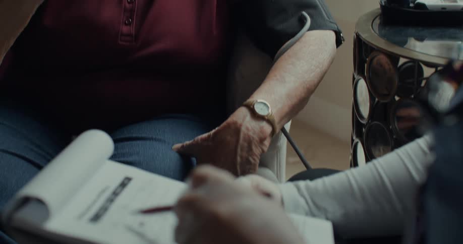 A nurse and a patient have a discussion