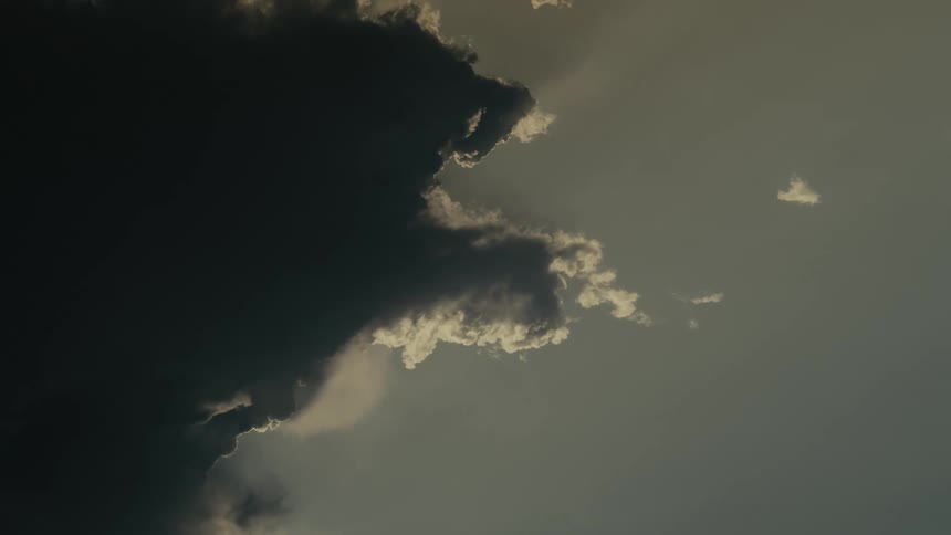 Dark storm clouds flow over the sky