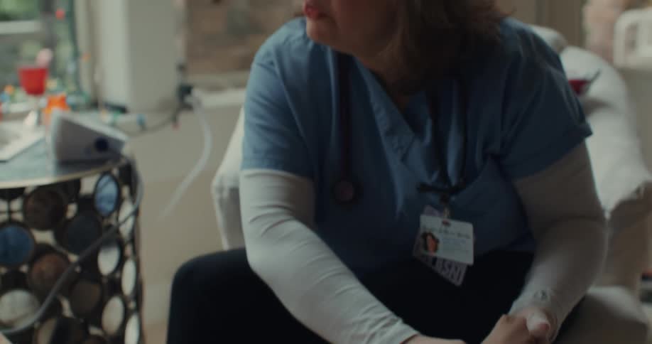 A nurse examines a patients foot