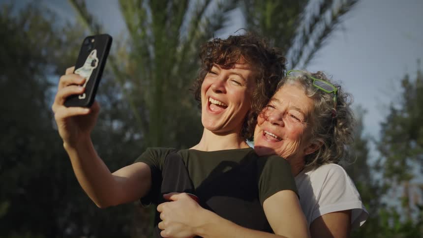 Two women pose for a selfie together