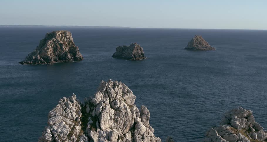 Rocky islands on a calm sea under a clear sky