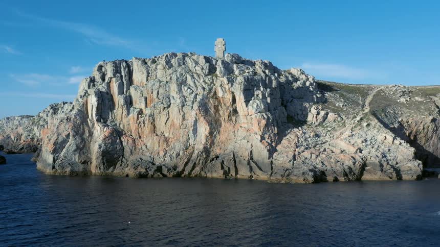 A rocky island surrounded by the sea