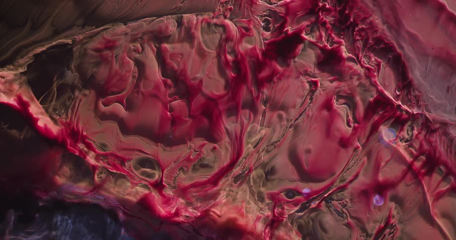 Abstract fluid and bluish and reddish dense liquid in slow motion