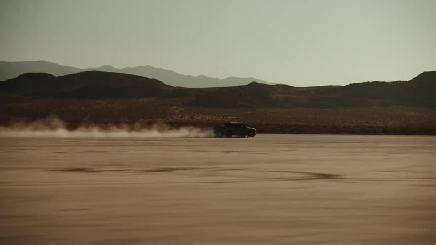 A car races across a desert