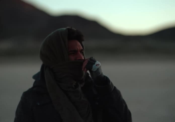 A clip of a man uncovering his nose mask