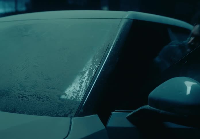 A man climbing into a truck