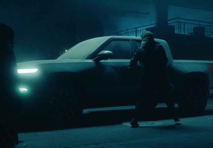 A clip of a man entering inside a car